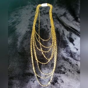 Gold tone necklace by Natasha